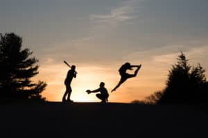 Silhouette Photo of Siblings playing baseball and dancing