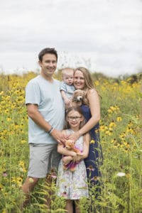 Family Photo in a field of flowers.