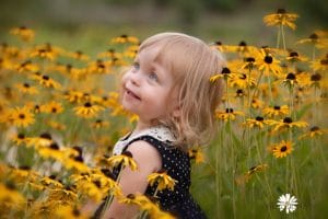 Kids photo session in wild flowers