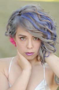 Corporate photo of a girl with colored hair for a Rockford, IL salon.